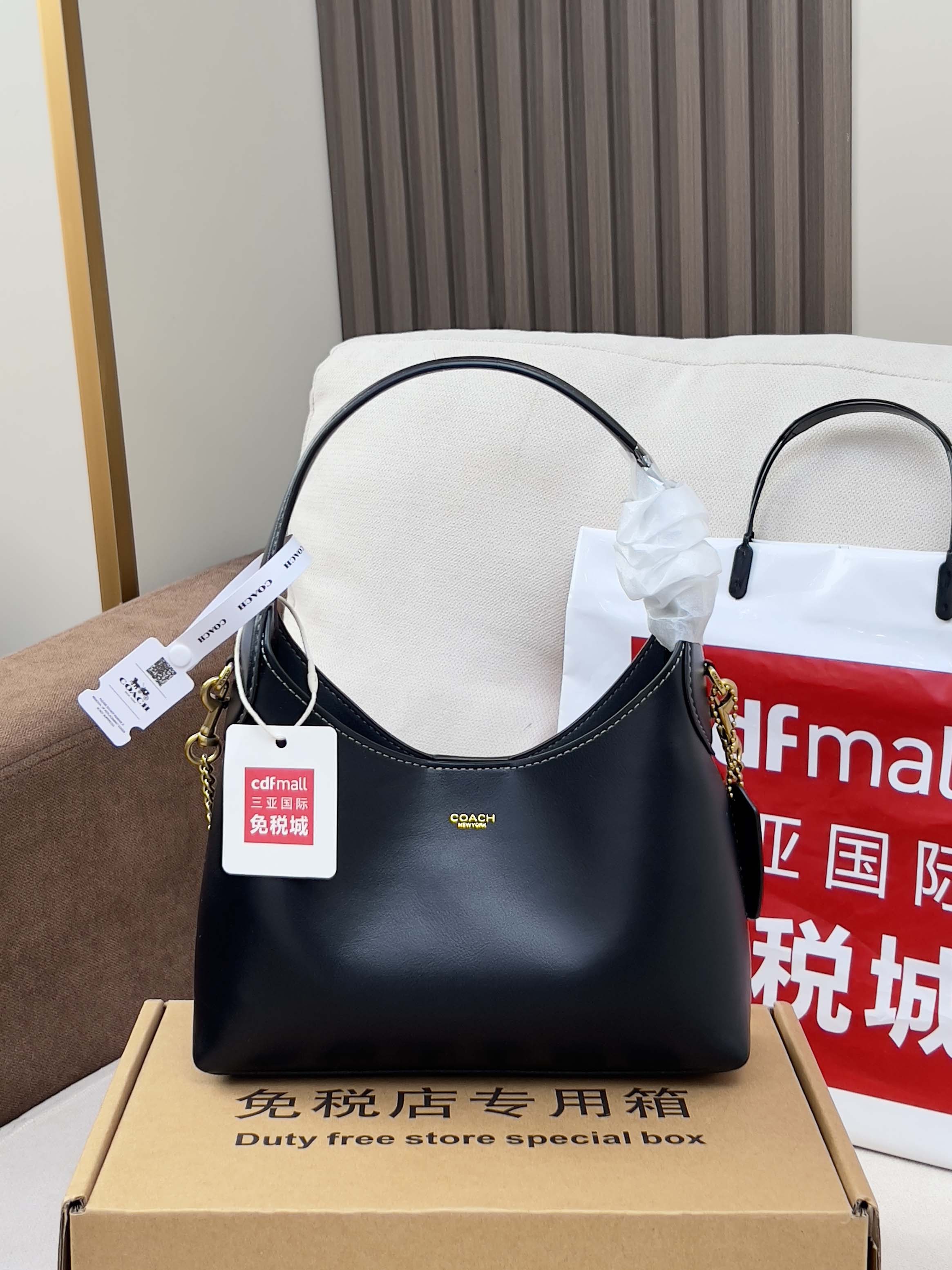 COACH navy leather hobo-style shoulder bag with short handles and chain strap