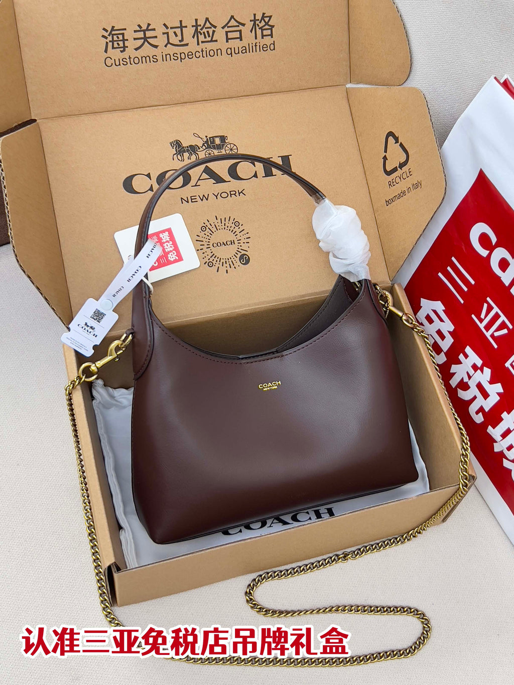 Coach hobo bag in dark brown with gold chain strap and top handle