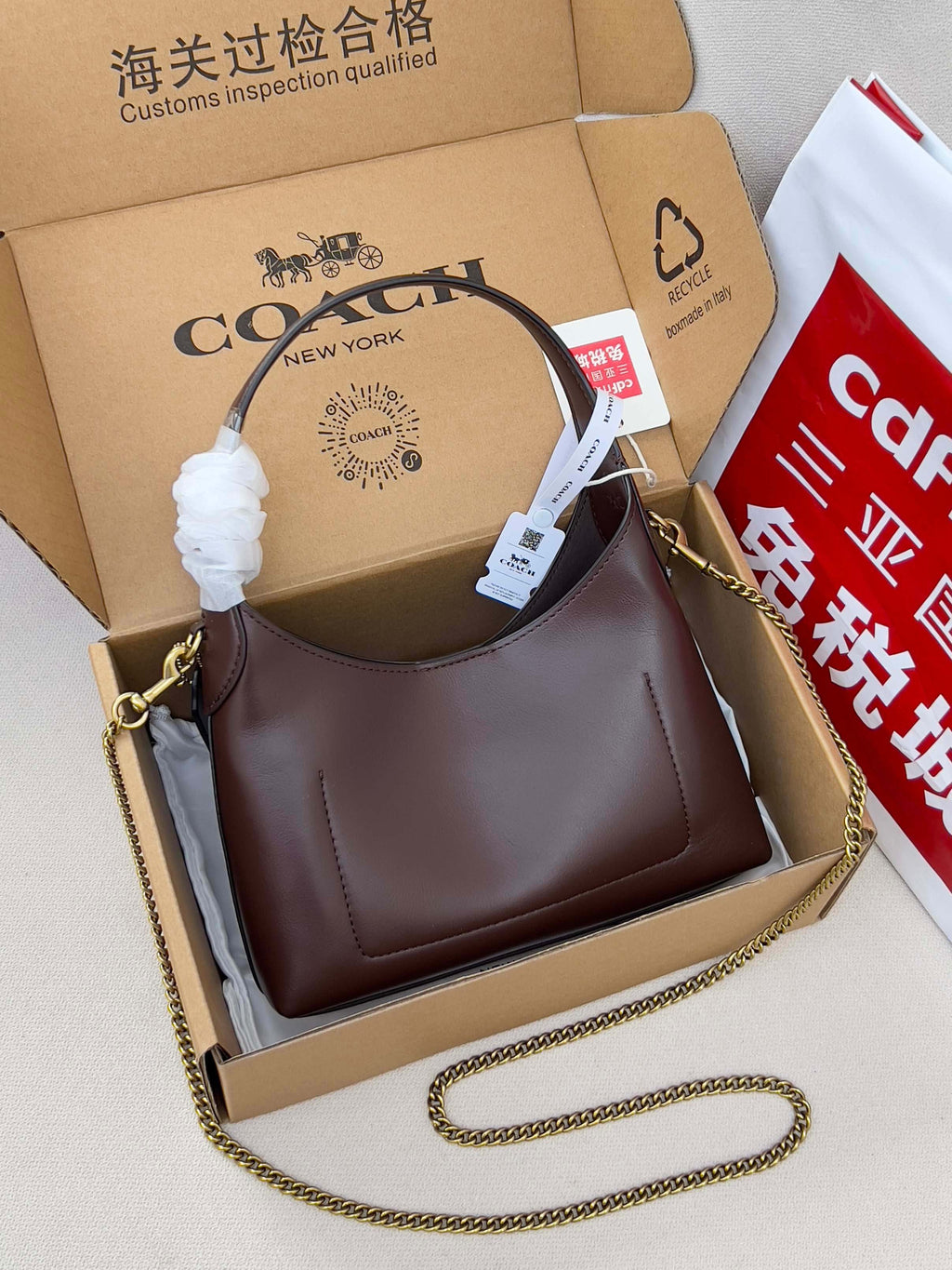 Coach hobo bag in dark brown leather with gold chain shoulder strap
