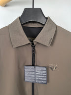 Men's Prada jacket collar close-up, taupe with black inner trim and zip front