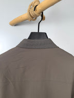 Men's Prada jacket back neckline view, taupe with textured stand collar