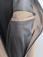 Men's Prada jacket open zip close-up, interior lining with taupe and gray pocket