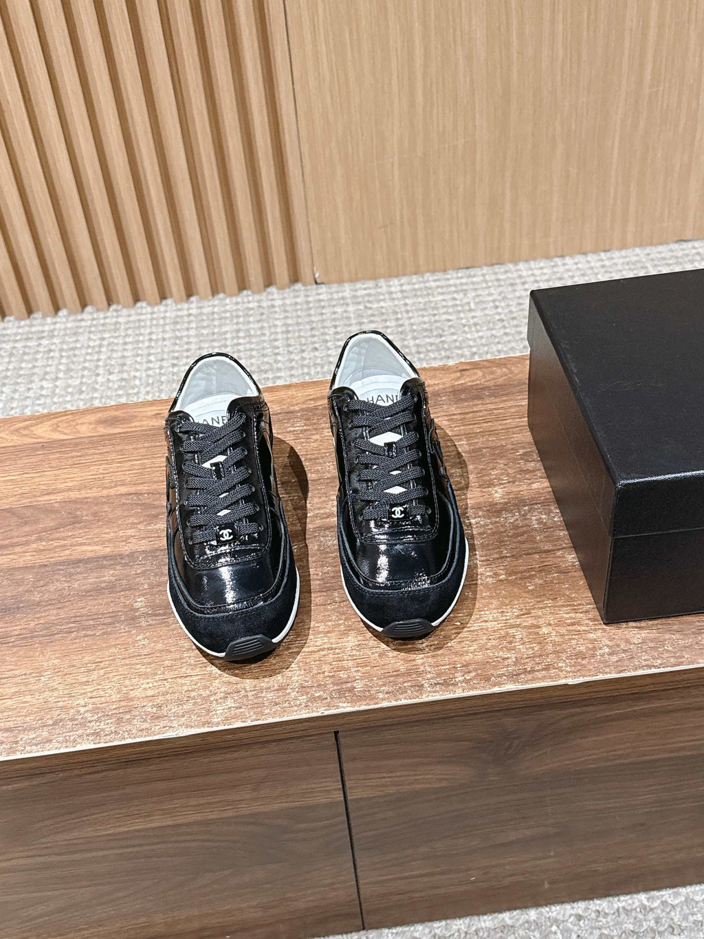 Black patent lace-up shoes with white rubber sole, Chanel logo detail