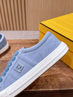 Light blue suede slip-on sneaker with blue fuzzy strap and FENDI logo on side