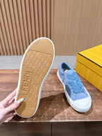 Light blue suede slip-on sneakers with textured outsole and FENDI embossed on sole