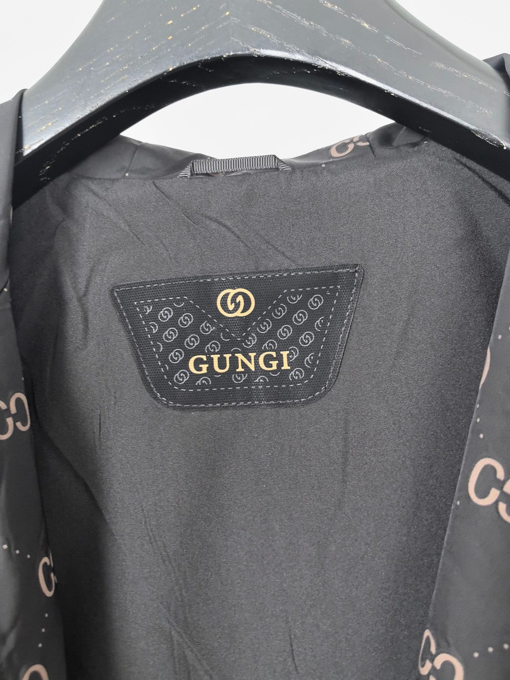 Gucci hooded jacket, dark gray with rectangular logo patch at neckline