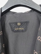 Gucci hooded jacket, dark gray with rectangular logo patch at neckline