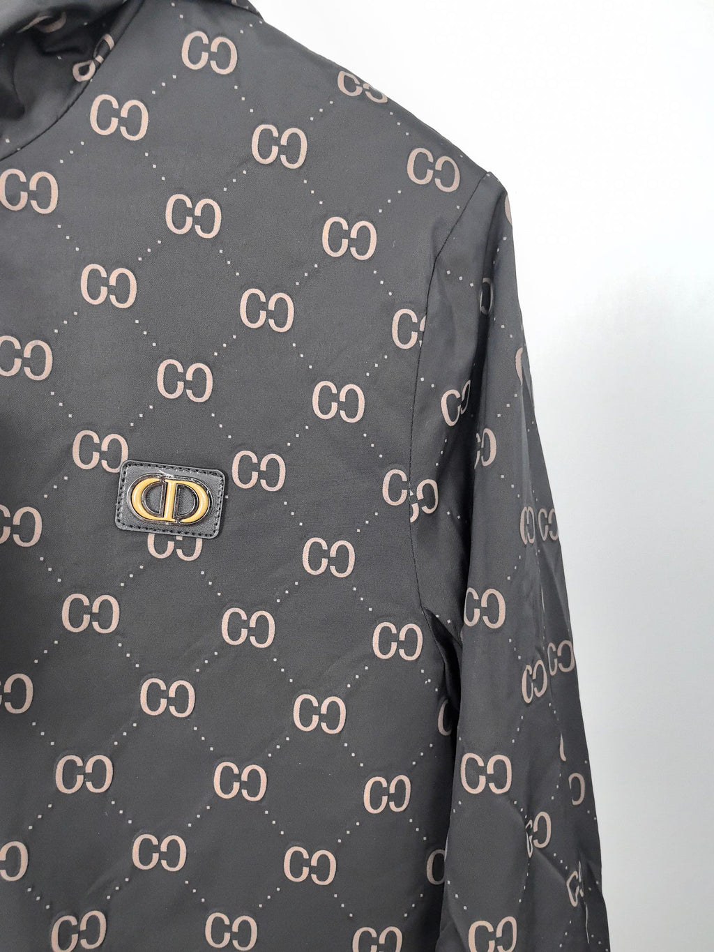 Gucci hooded jacket, dark gray with repeating GG pattern, front logo plate