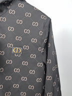 Gucci hooded jacket, dark gray with repeating GG pattern, front logo plate