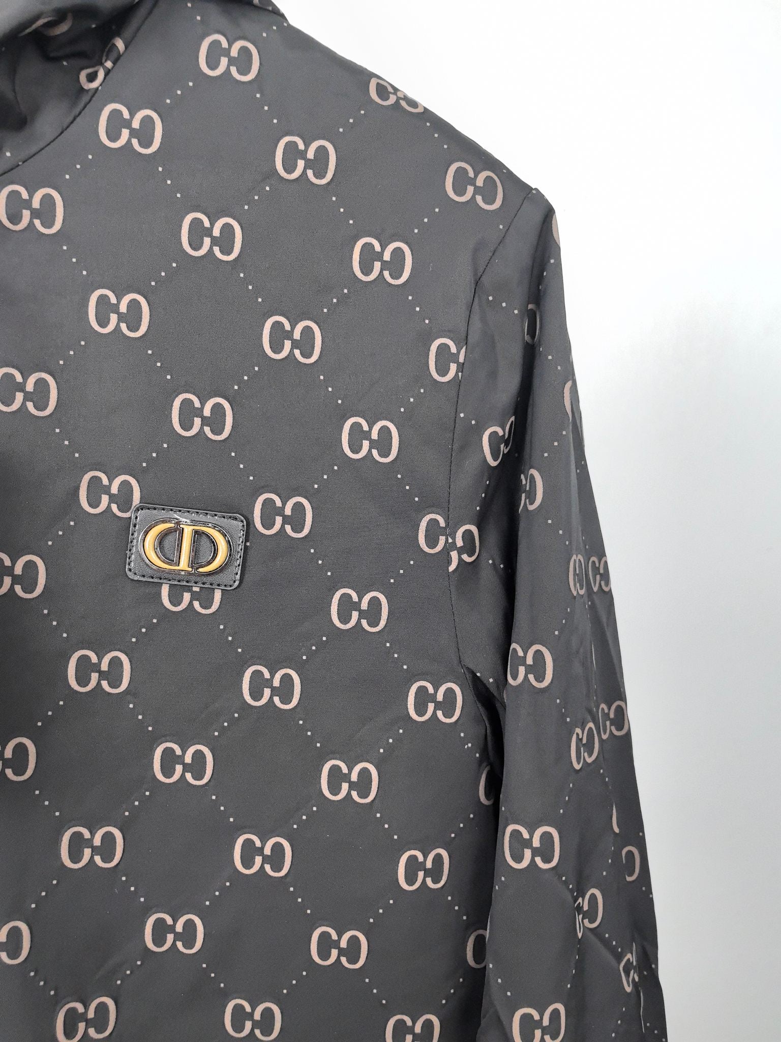 Gucci hooded jacket, dark gray with repeating GG pattern, front logo plate