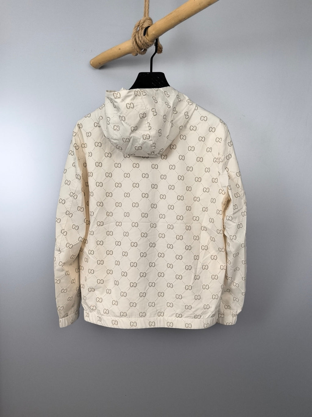 Cream long jacket with repeating GG monogram pattern and full back view
