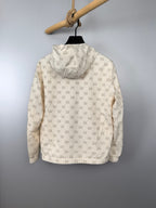 Cream long jacket with repeating GG monogram pattern and full back view