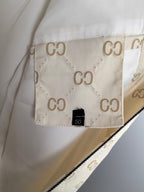 Cream long jacket interior lining with size tag and GG monogram pattern