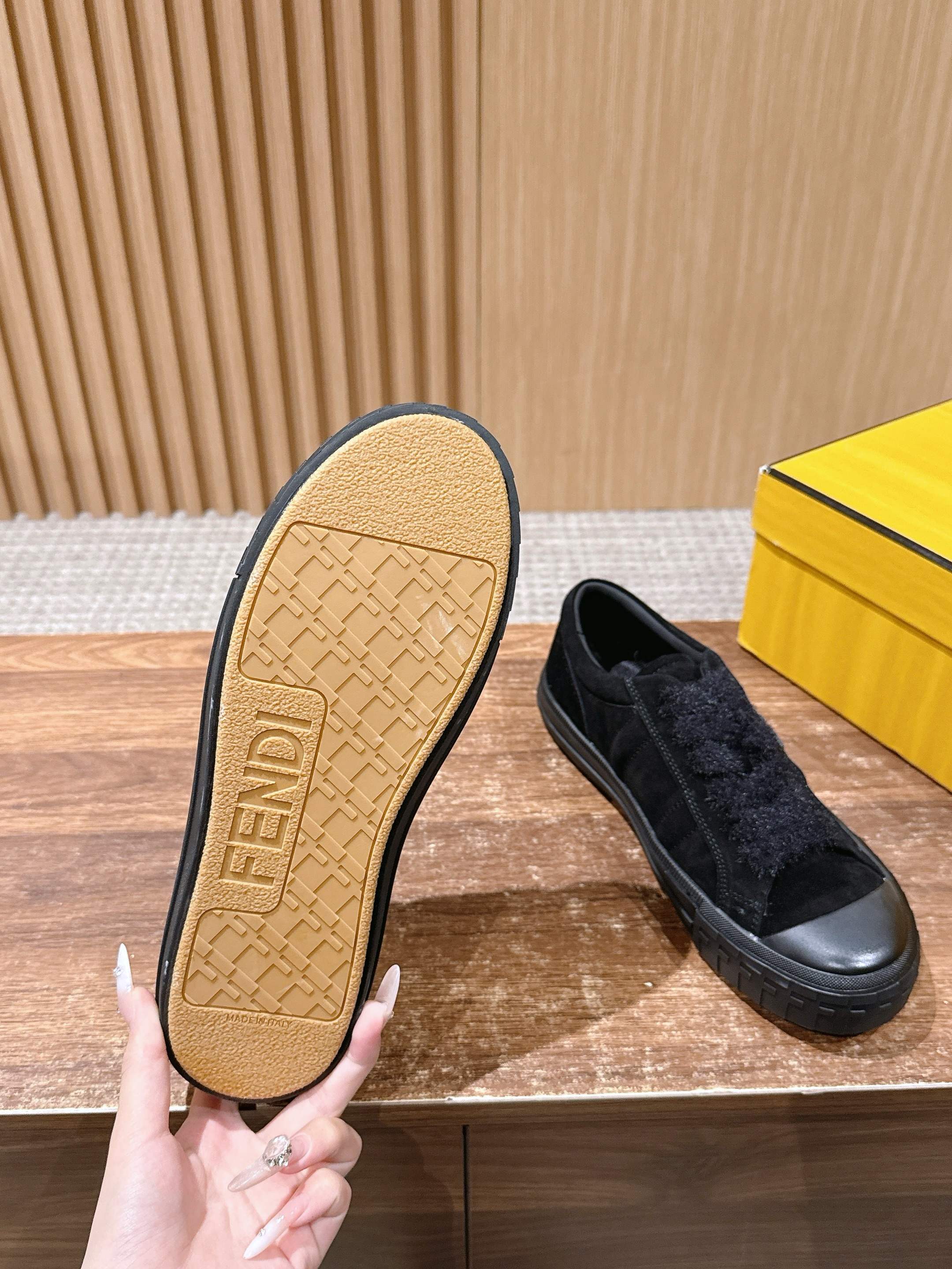 Suede slip-on shoe outsole, tan rubber bottom with tread, plus matching black upper