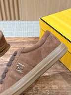 Brown suede sneaker with F logo patch, stitched trim, and side seam detail