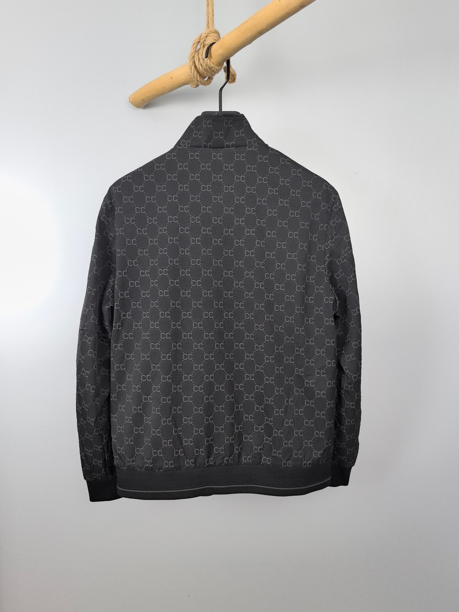 Gucci monogram zip jacket, back view with stand collar and ribbed hem