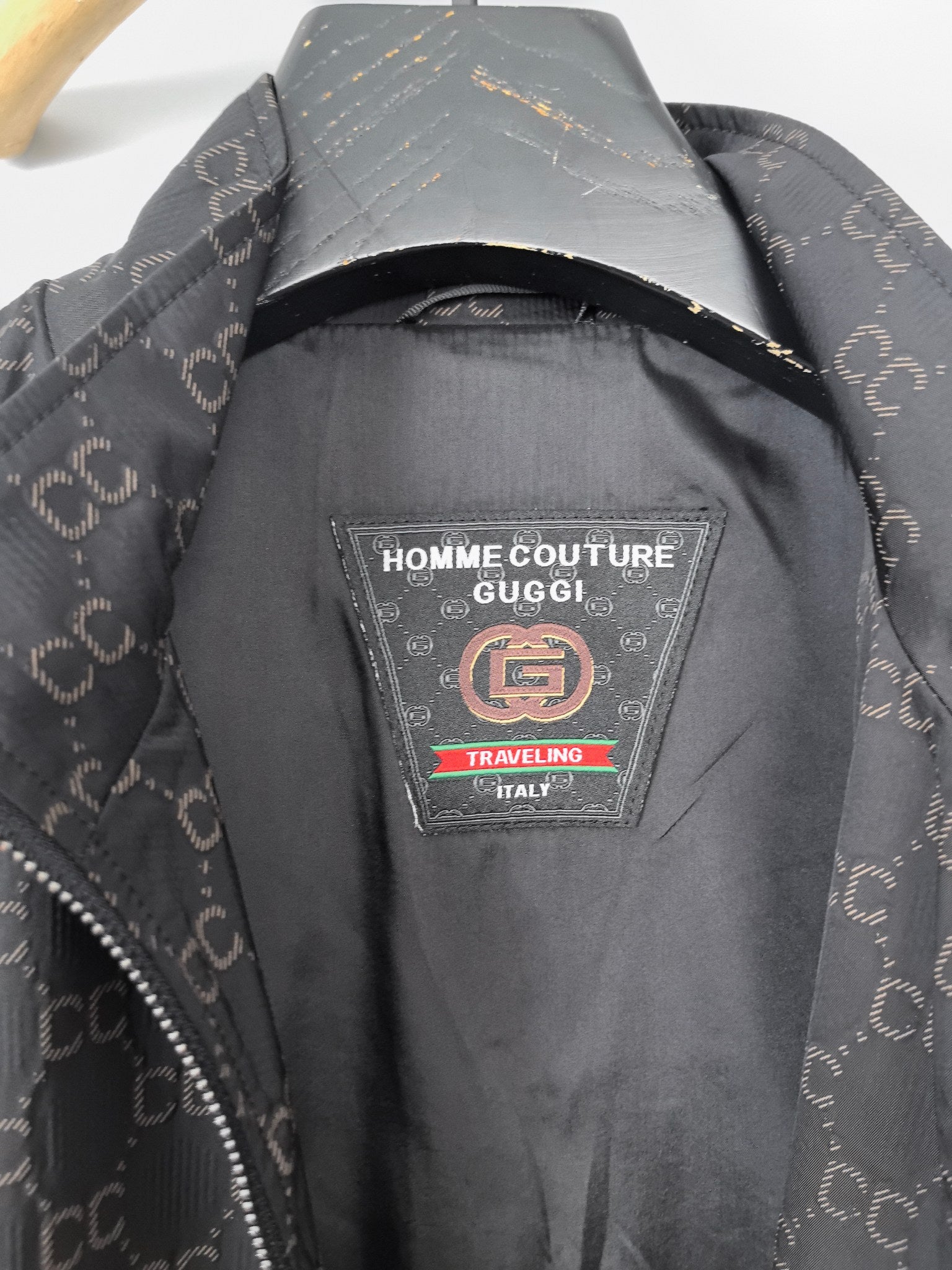 Gucci monogram zip jacket neck label area with black interior and trim