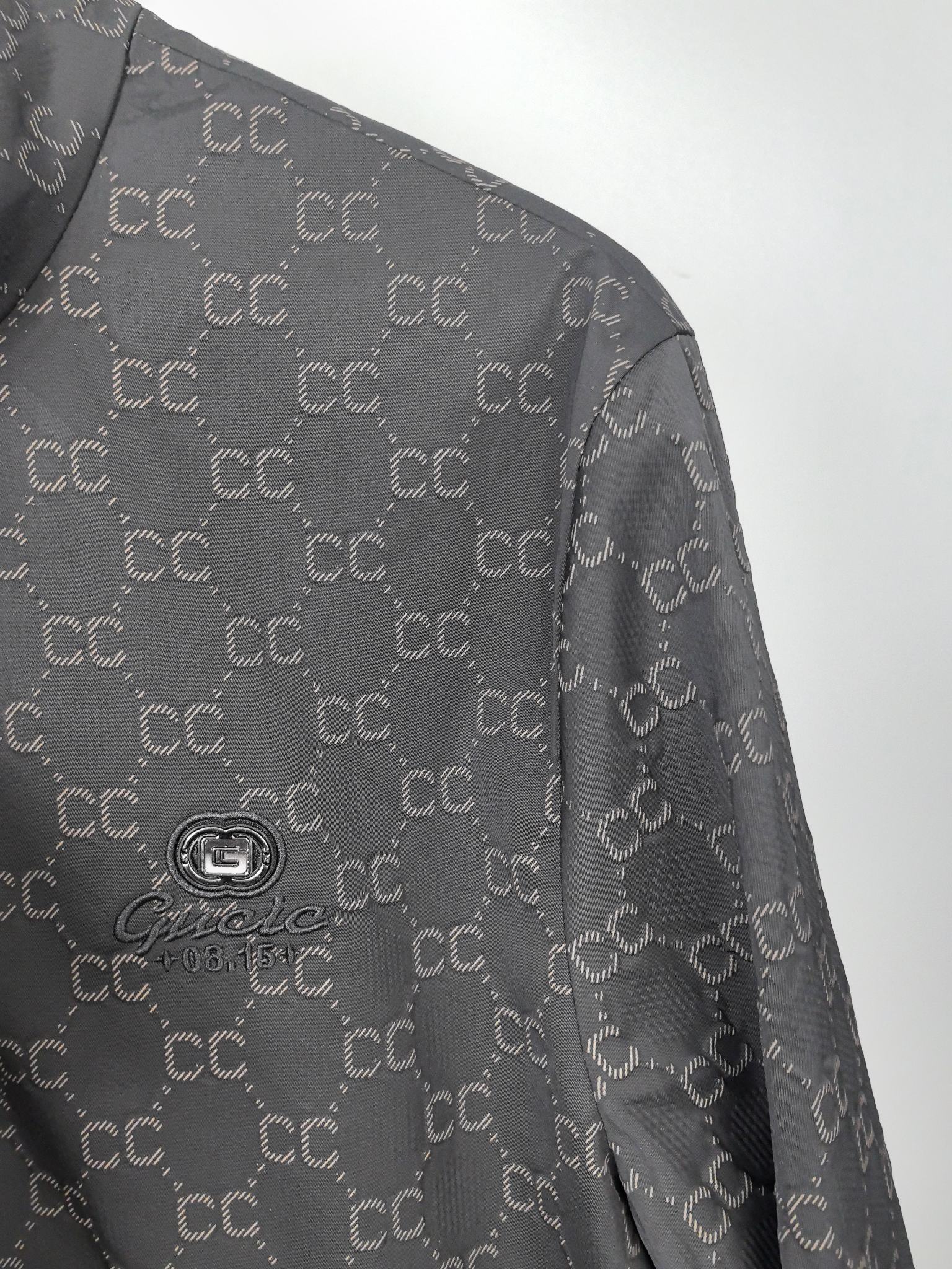 Gucci monogram zip jacket shoulder and upper sleeve with subtle fabric texture