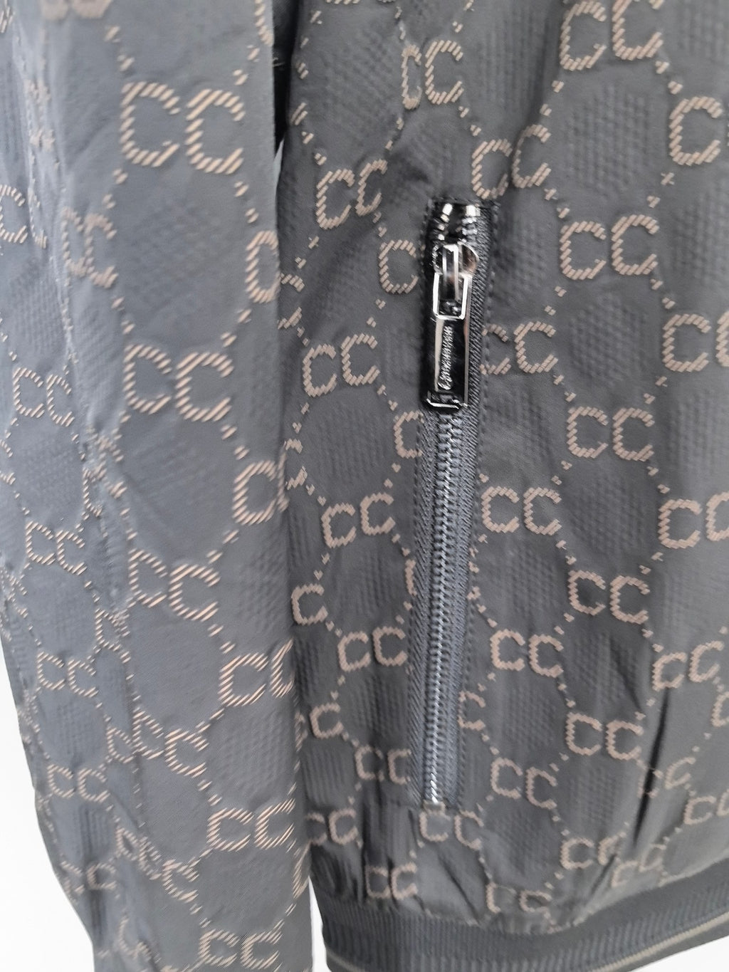Gucci monogram zip jacket front zipper detail with metal pull