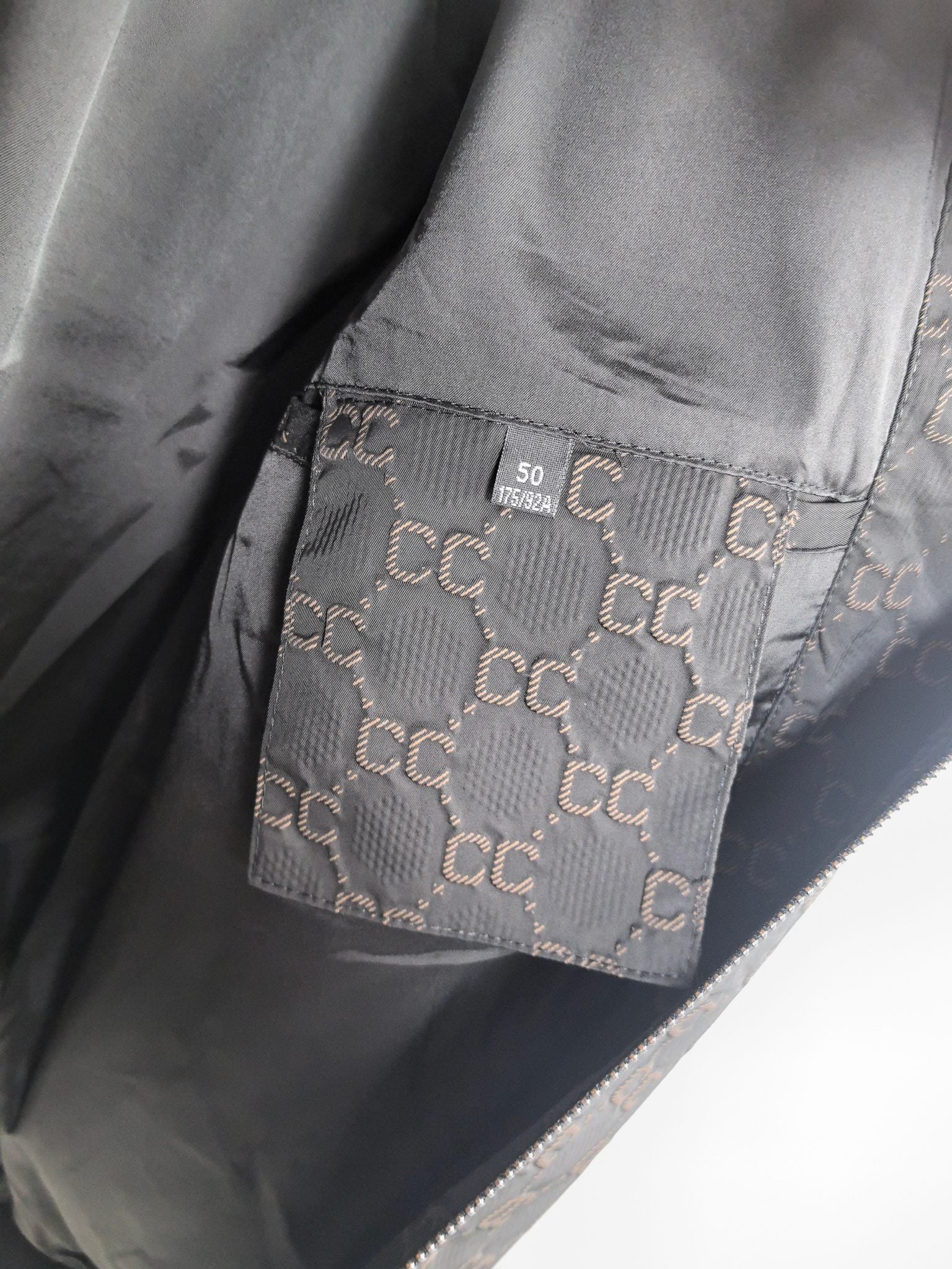 Gucci monogram zip jacket inner pocket panel with stitched label patch
