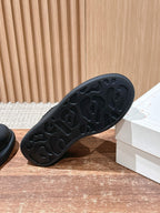 Black rubber outsole with molded tread pattern on low-top sneaker