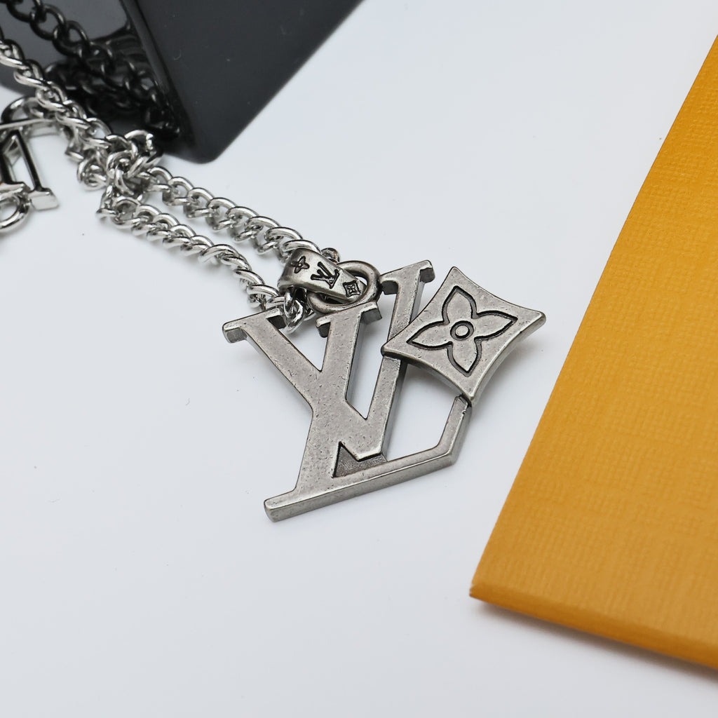 Silver tone Louis Vuitton charm necklace with LV pendant and chain links