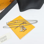 Silver Louis Vuitton charm necklace with LV pendant and layered chain
