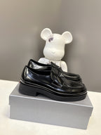 Prada unisex black leather loafers with thick platform sole and strap detailing