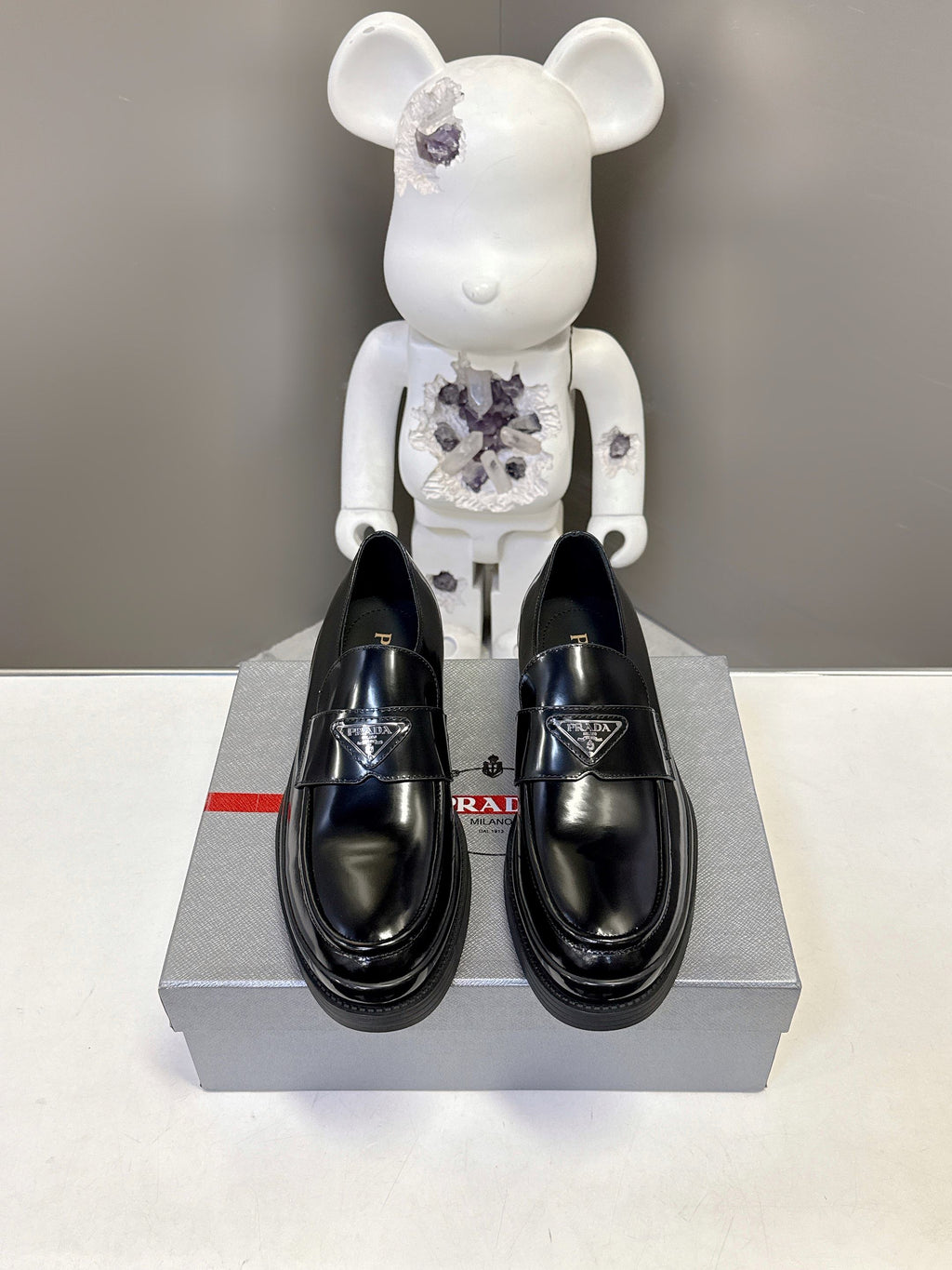 Prada unisex black leather loafers, polished finish, thick rubber platform sole