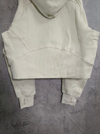 Cream zip-up hooded sweatshirt with kangaroo pocket and ribbed ankle-length cuffs