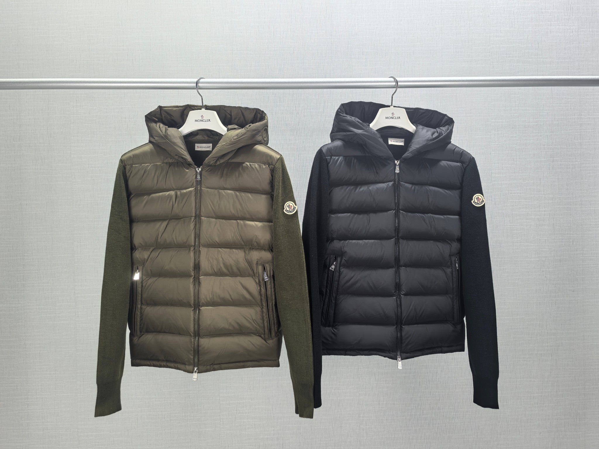 Moncler hooded puffer jackets on hangers, olive and dark, full zip