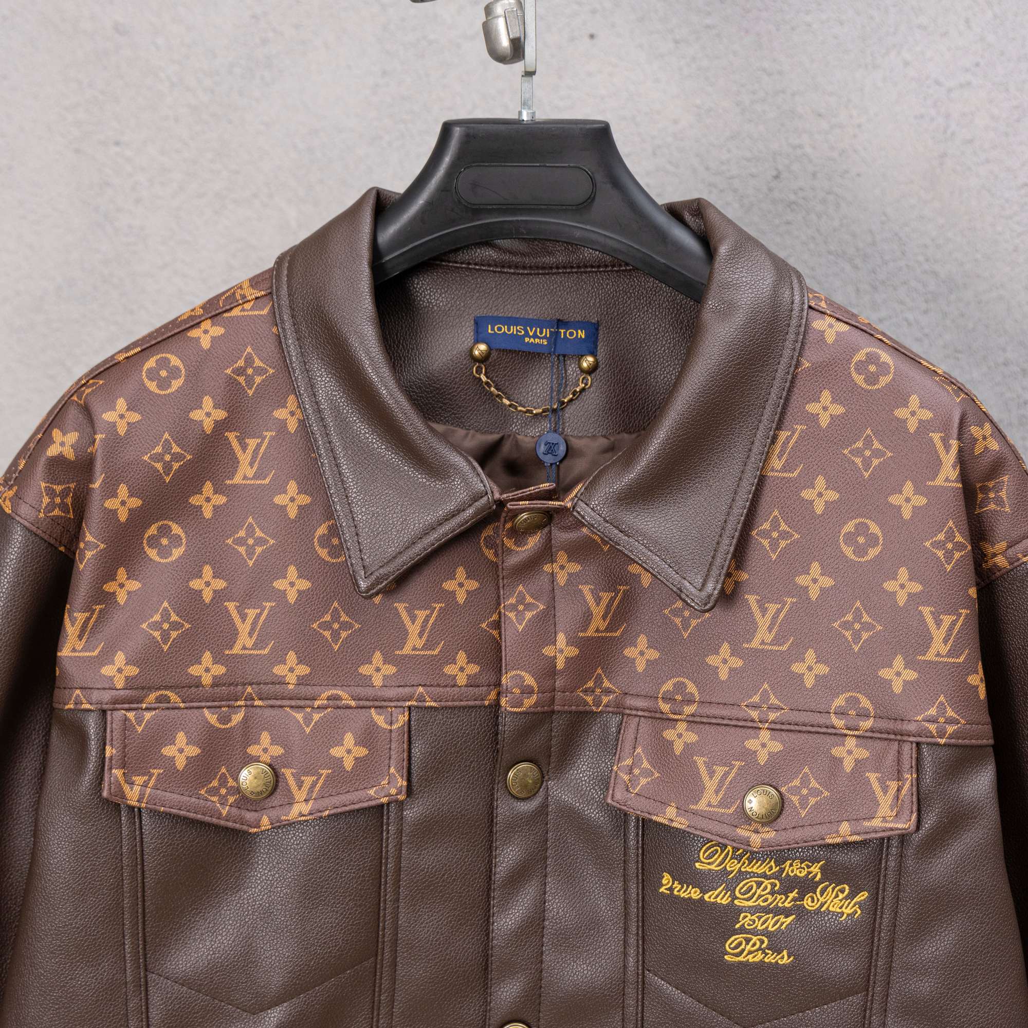 Louis Vuitton long coat front, brown leather with monogram shoulders and chest snap buttons