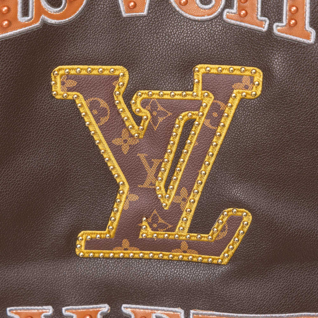 Louis Vuitton LV studded logo on brown leather, gold trim and “V” emblem
