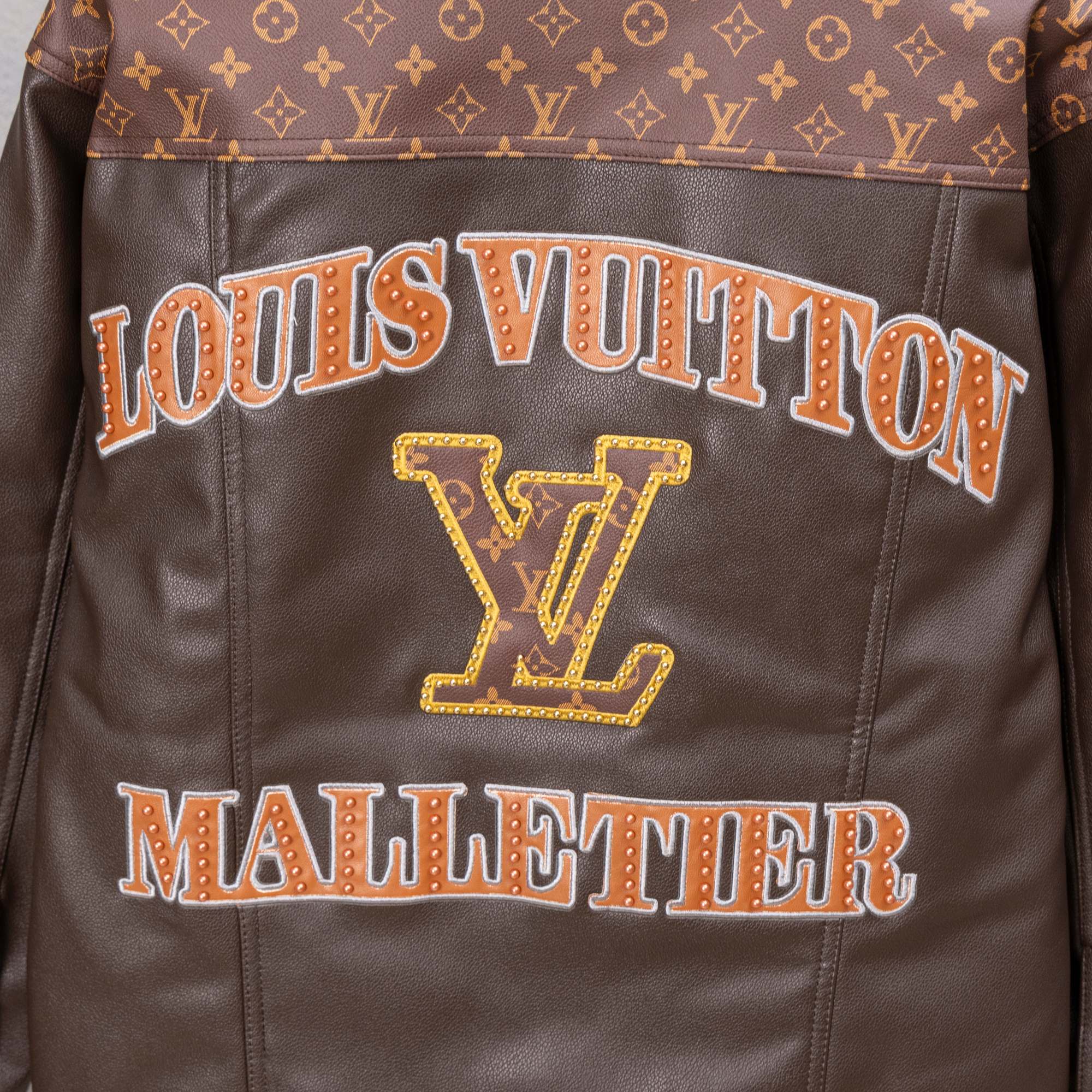 Louis Vuitton long coat back graphic, “LOUIS VUITTON” text with LV emblem