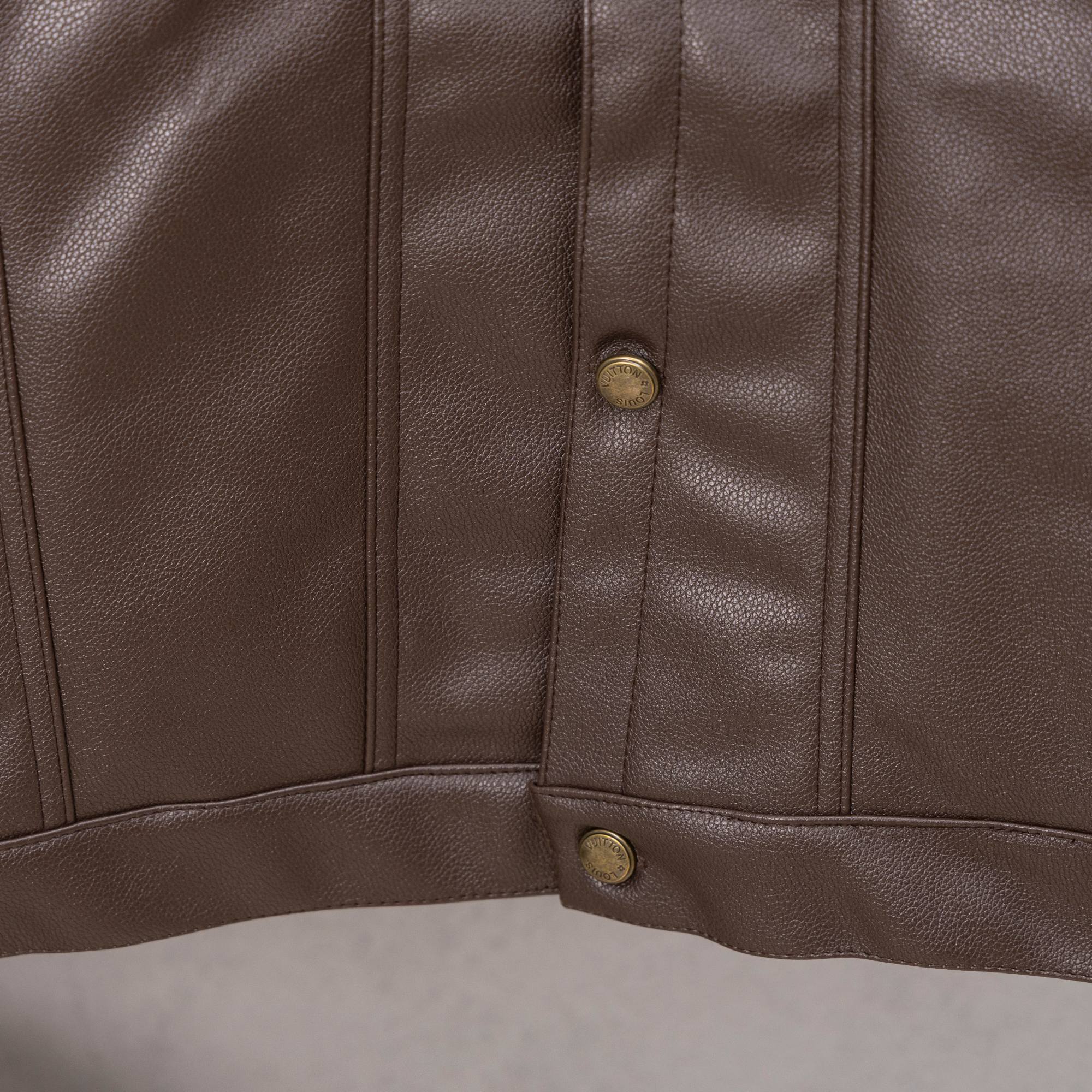 Louis Vuitton long coat hem, brown leather with snap buttons and vertical panel stitching
