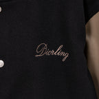 Black jacket front with Diorling cursive logo embroidery