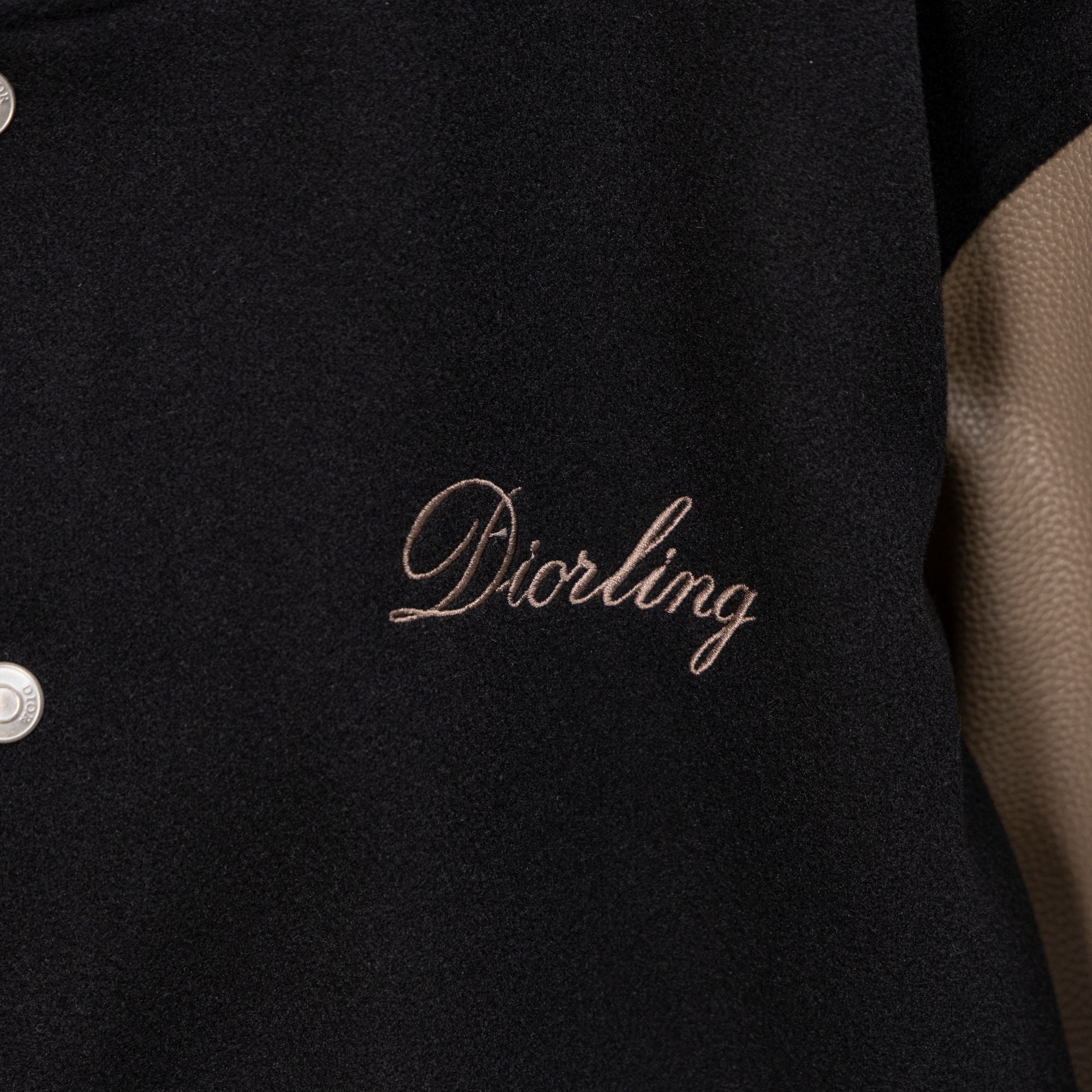 Black jacket front with Diorling cursive logo embroidery