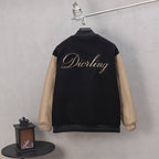 Black long-sleeve varsity jacket with Diorling logo on back and beige sleeves