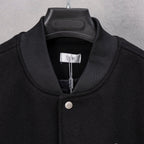 Black long-sleeve jacket with ribbed collar and DIOR label at neck