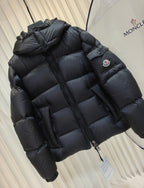 Moncler long padded jacket, dark quilted puffer, hooded neckline, sleeve logo patch