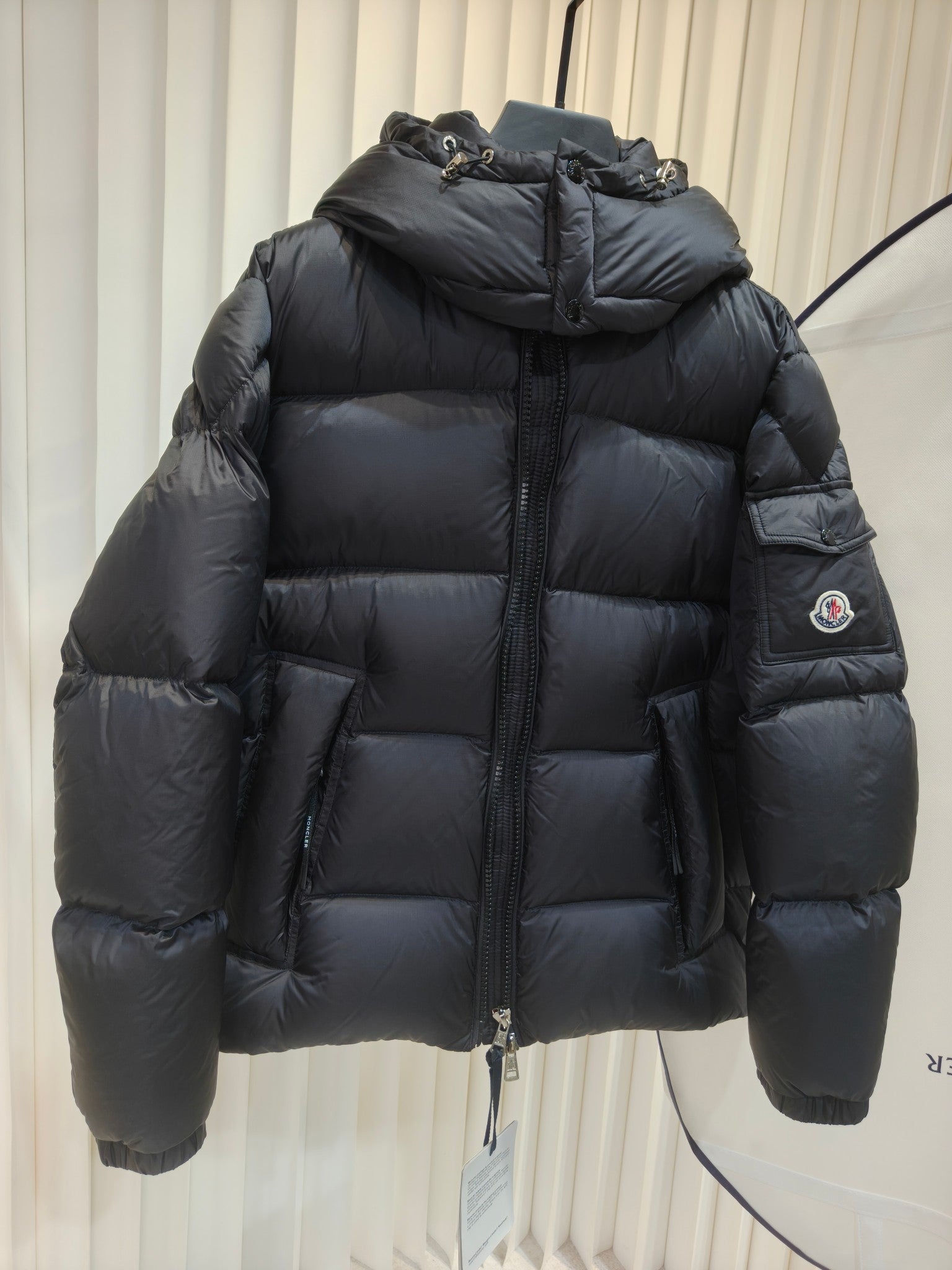 Moncler long padded jacket, dark quilted puffer with hood, full-zip and front pockets