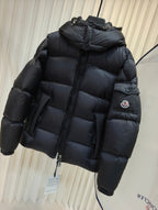 Moncler long padded jacket, dark quilted puffer with hood and zip front, sleeve patch