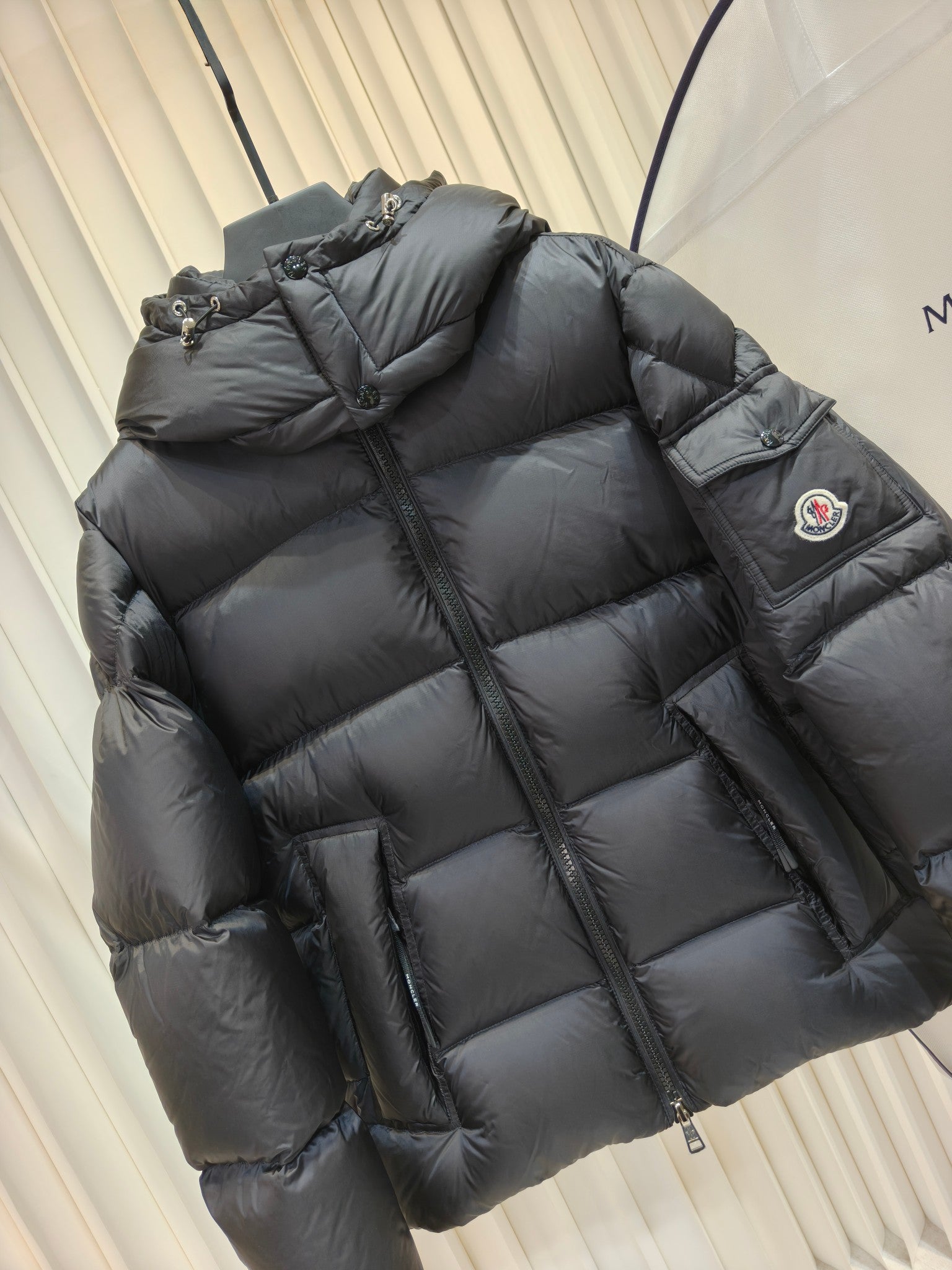 Moncler long padded jacket, dark quilted puffer, hood, zip front, side pocket panel