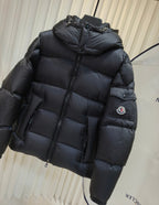 Moncler long padded jacket, dark quilted puffer with hood, full-zip front, sleeve patch