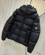 Moncler long padded jacket in dark color, quilted puffer with hood and zip front