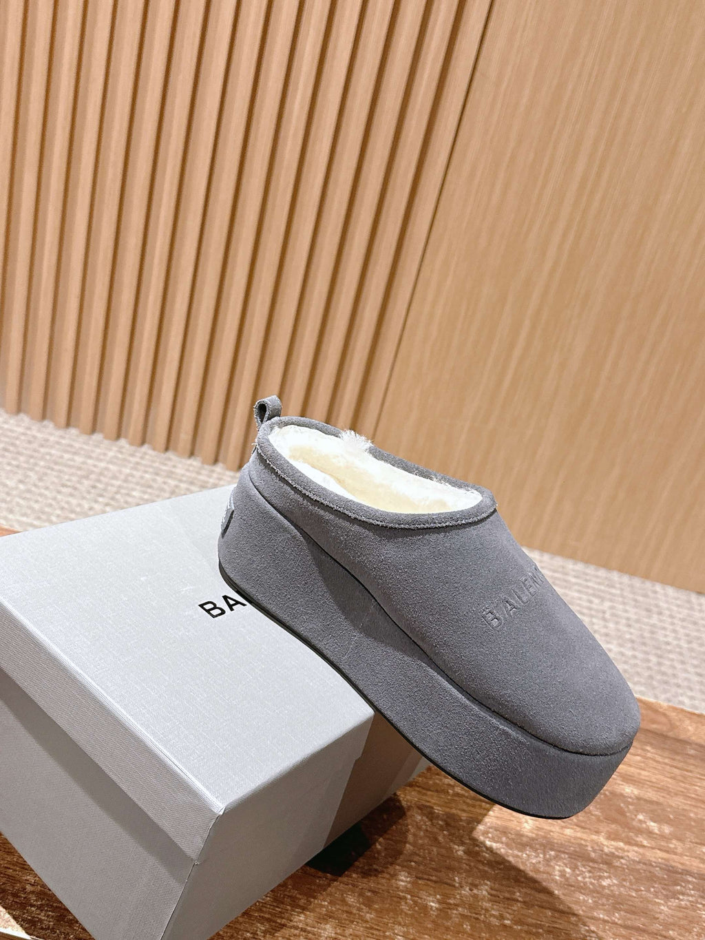 Grey Balenciaga slide sandal on its white box, open back and padded insole