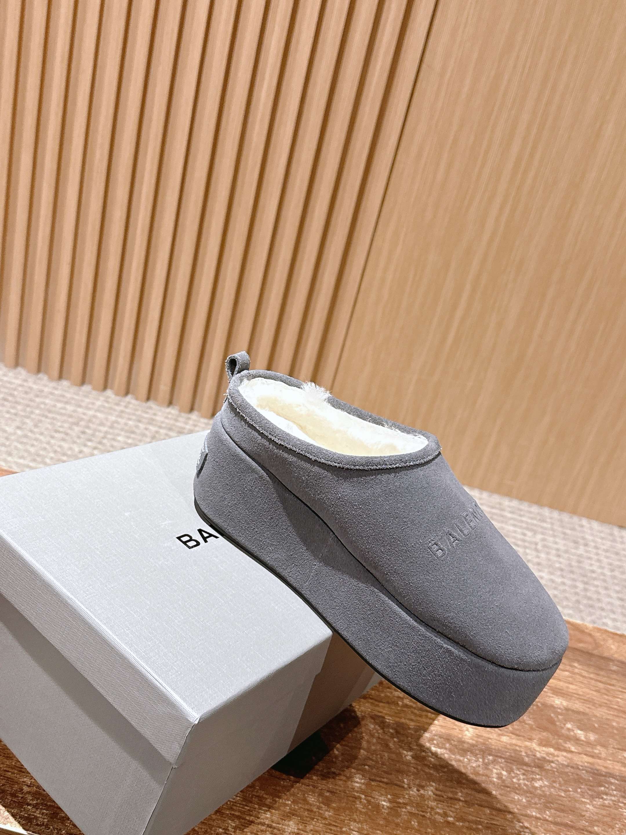 Grey Balenciaga slide sandal on its white box, open back and padded insole