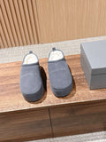 Grey Balenciaga slide sandals with open back and cushioned footbed, pair shown