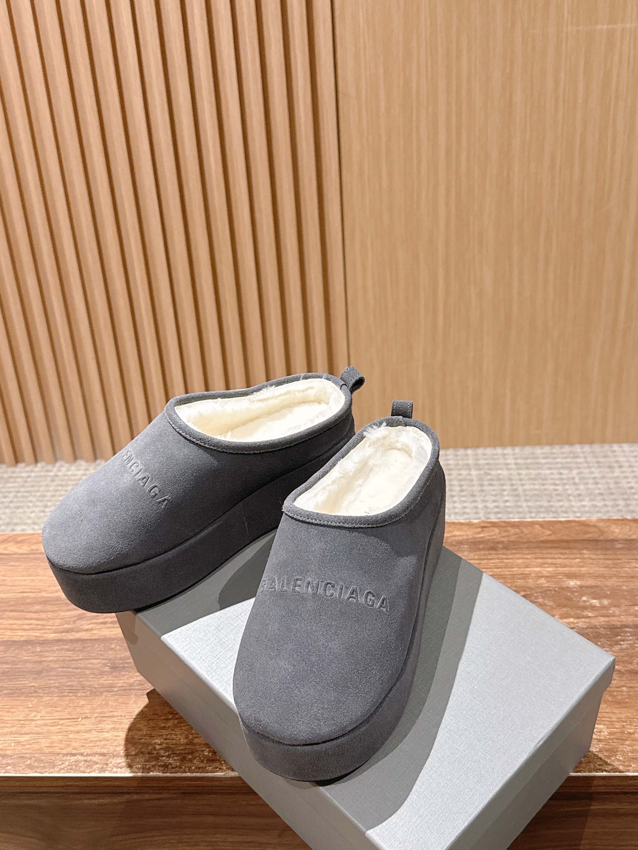 Grey Balenciaga slide sandals with open back, pair on white boxes