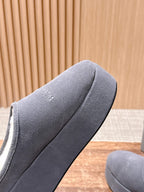 Grey Balenciaga slide sandal close-up, textured fabric upper with embossed logo